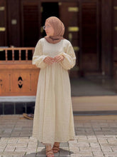 Modest off-white maxi dress by Yezwe with long sleeves and relaxed fit for comfortable wear